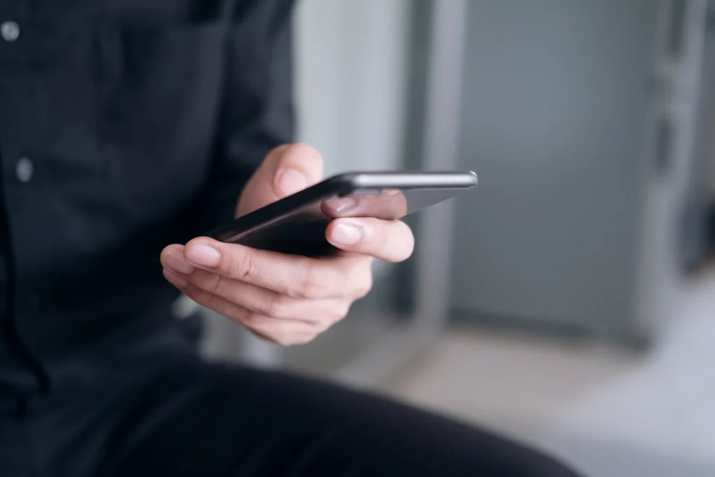 a closeup of a man s hands using a smartphone 2023 11 27 04 58 17 utc